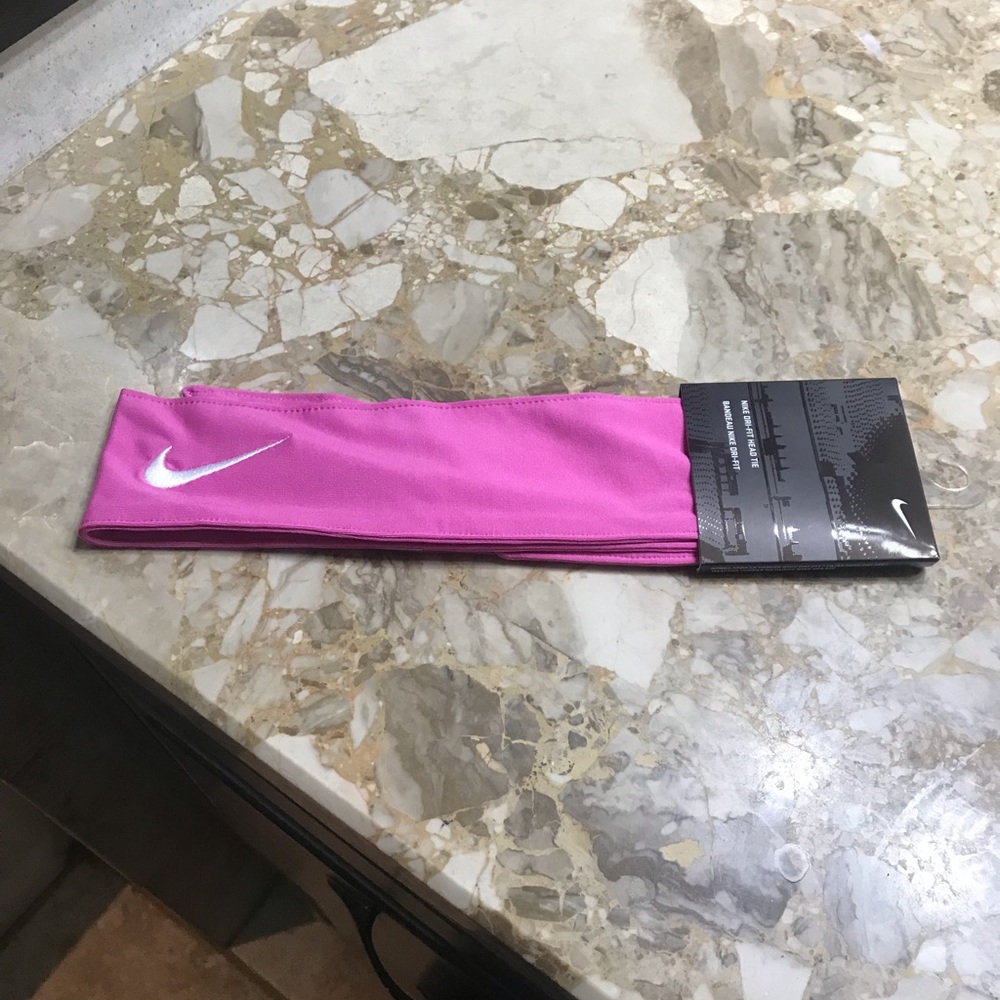 Nike new head tie with white swoosh on it.